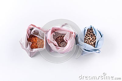 Reusable eco friendly natural cotton produce bags with cereal. Waste packaging. Zero waste food shopping. Plastic free Stock Photo