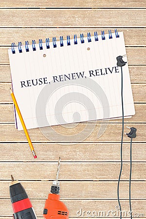 Reuse, renew, relive against tools and notepad on wooden background Stock Photo