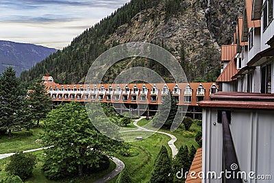 Three Valley Lake Chateau Balcony view with gardens overlooking the Selkirk Mountains. Editorial Stock Photo