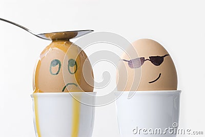 Revenge, punishment, violence, sadness, unhappiness, victim concept, faces drawn on boiled eggs Stock Photo