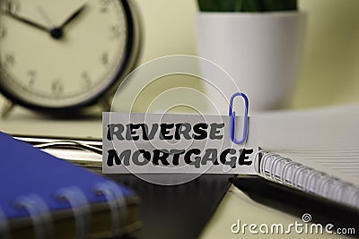 Reverse Mortgage on the paper isolated on it desk. Business and inspiration concept Stock Photo