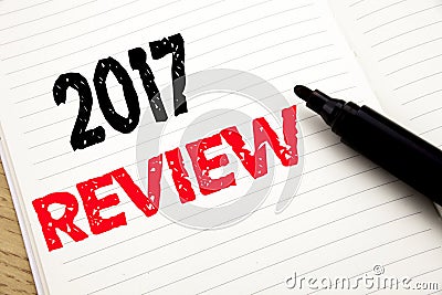 2017 Review. Business concept for Annual Summary Report written on notebook with copy space on book background with marker pen Stock Photo