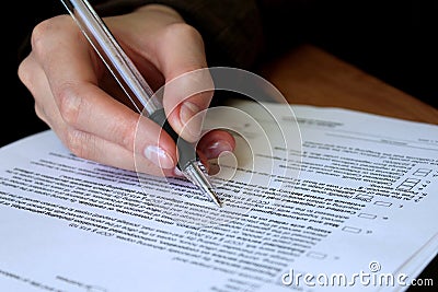 Review and filling out legal contract Stock Photo