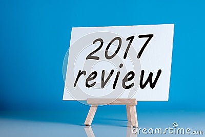 2017 review - poster with an inscription on a blue background. Time to summarize and plan goals for the next year Stock Photo