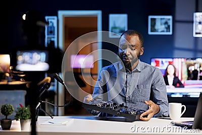 Reviewer unhappy after testing DJ device Stock Photo