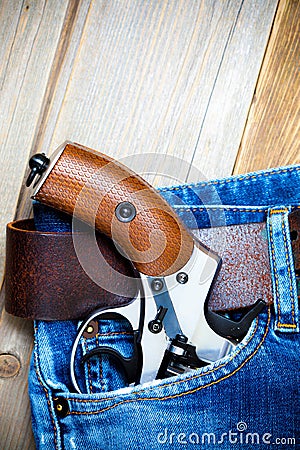 Revolver in the pocket Stock Photo