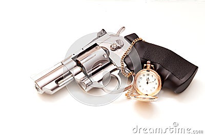 Revolver and a pocket watch Stock Photo