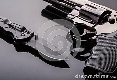 Revolver and tactical knife Stock Photo