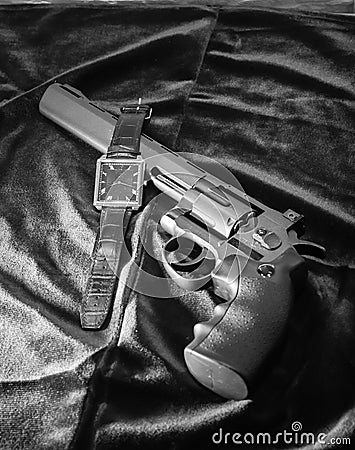 The revolver and the watch Stock Photo