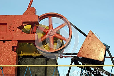 Revolving flywheel of oil pumpjack Stock Photo