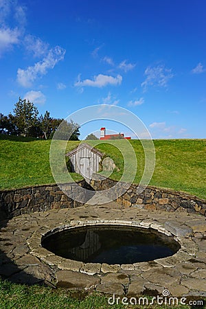 Reykholt, Iceland: Snorralaug, the warm outdoor bathing pool of Snorri Sturluson Editorial Stock Photo