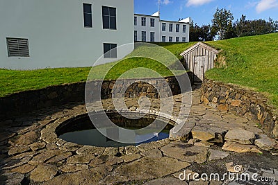 Reykholt, Iceland: Snorralaug, the warm outdoor bathing pool of Snorri Sturluson Editorial Stock Photo