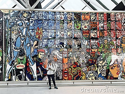 A tile mural filled of comic books is the center of Reykjavik Airport Editorial Stock Photo