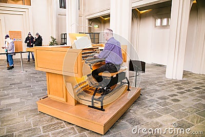 Musician play Pipe Organ in Hallgrimskirkja church, Reykjavik , Iceland Editorial Stock Photo