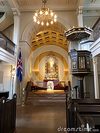 Reykjavik, Iceland - July 02, 2018: Domkirkjan - Reykjavik Lutheran Cathedral. Inside view, altar and pulpit. Domkirkjan was the Editorial Stock Photo