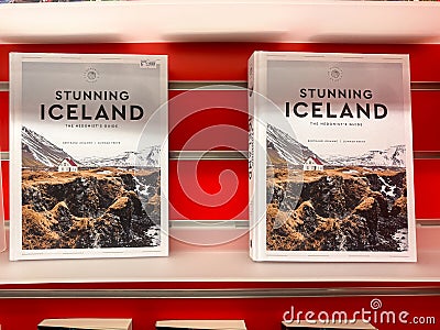 Stunning Iceland, the Hedonists Guide books on sale at a store, feature beautiful landscape Editorial Stock Photo