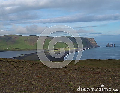 Reynisdrangar - magic iceland landscape with black lava sand and Stock Photo