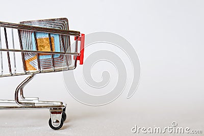 RFID tag in a supermarket trolley. Shoplifting Prevention. Goods security and alarm. Light background. Free space for an Stock Photo