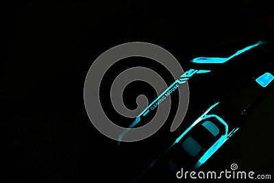 RGB light Blue Color Gaming Mouse Dark, Black Wallpaper Background. Gaming Background Wallpaper. Editorial Stock Photo