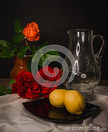 Rhapsody of Elements: Roses, Vase, Lemon, and Linen Stock Photo