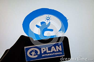 Rheinbach, Germany 1 April 2022, The brand logo of the aid organization `Plan International` on the display of a smartphone Editorial Stock Photo