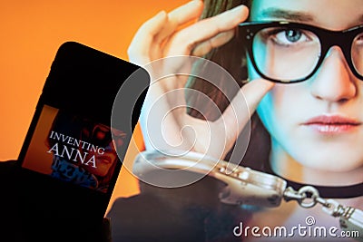 Rheinbach, Germany 2 March 2022, The logo of the new Netflix series `Inventing Anna` on the display of a smartphone Editorial Stock Photo