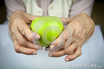 Rheumatoid arthritis hands and fruits Stock Photo