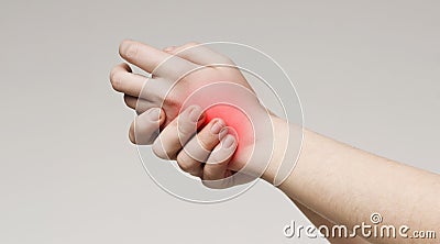 Millennial woman touching her inflamed painful hand Stock Photo