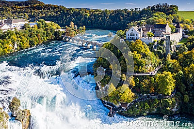 Rhine Falls or Rheinfall, Switzerland panoramic aerial view. Tourist boat in waterfall. Bridge and border between the cantons Stock Photo