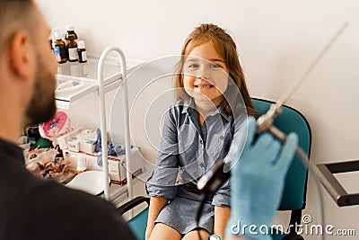 Rhinoscopy of child nose. Consultation with doctor. Children otolaryngologist calms child before procedure of rhinoscopy Stock Photo