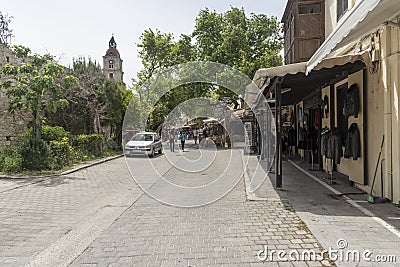 Shops and clock tower Rhodes town Greece Stock Photo