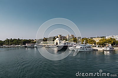 Boats docked in front of the city of Rhodes Editorial Stock Photo