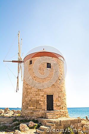 Rhodes Windmill in Mandraki Harbour, Rhodes, Greece Stock Photo