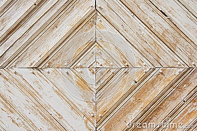 Rhomb pattern of the old weathered white-painted wooden gate. Stock Photo