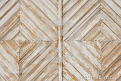 Rhomb pattern of the old weathered white painted wooden gate. Stock Photo