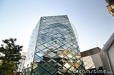 Rhomboid-grid glass building in tokyo Stock Photo