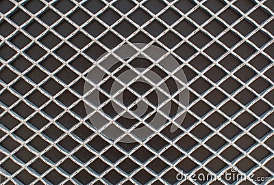 Rhombus metal pattern on black surface Stock Photo