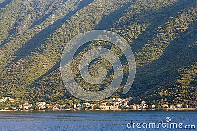 Rhythmic texture of a steep mountain slope, illuminated by the sun Stock Photo