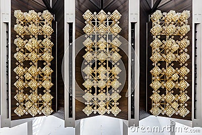 Rhythmic texture on suspended ceiling with rows of halogen spots lamps and drywall construction with chandelier. Stretch ceiling Stock Photo