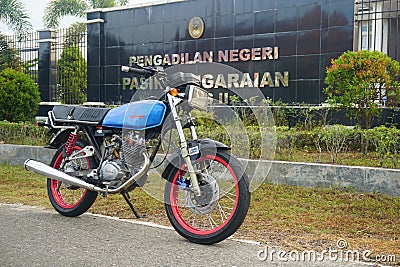 Riau, Indonesia, April 3 2022, my friend's classic blue Honda GL100 motorcycle Editorial Stock Photo