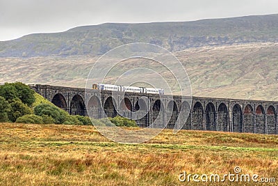 Ribblehead Viaduct with train crossing Stock Photo