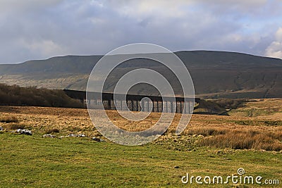 Ribblehead Viaduct under the brooding mass of Wernside, Yorkshires highest peak Stock Photo