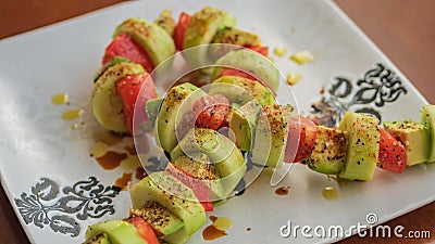 Ribbon bow shaped salad on a white plate Stock Photo