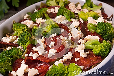 Ribbon pasta Casserole with chorizo and vegetables Stock Photo