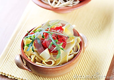 Ribbon pasta and peeled tomato Stock Photo