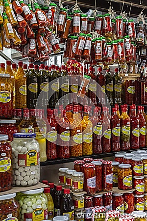 Jars with variety of peppers in municipal market of Ribeirao Preto. Preserved food background Editorial Stock Photo