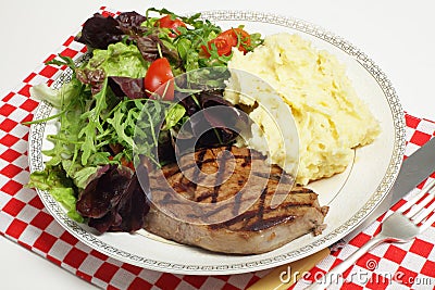 Ribeye steak with salad and celeriac potatoes Stock Photo