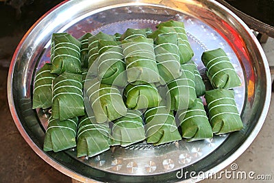 Rice in banana leaves on a tray, Asia Stock Photo