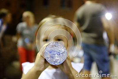 Rice being thrown at bride and groom as they exit by the church Stock Photo