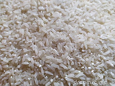 Rice beras in containers for daily staples Stock Photo